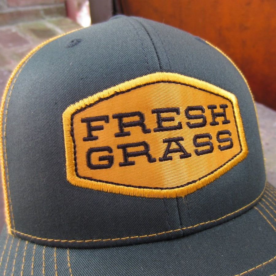 FreshGrass Trucker Hat: Green and Gold with Gold Logo