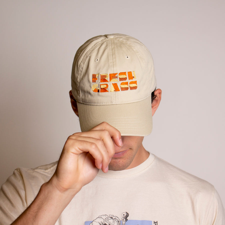 Freshgrass Baseball Hat: Cream with Alternative Orange Logo